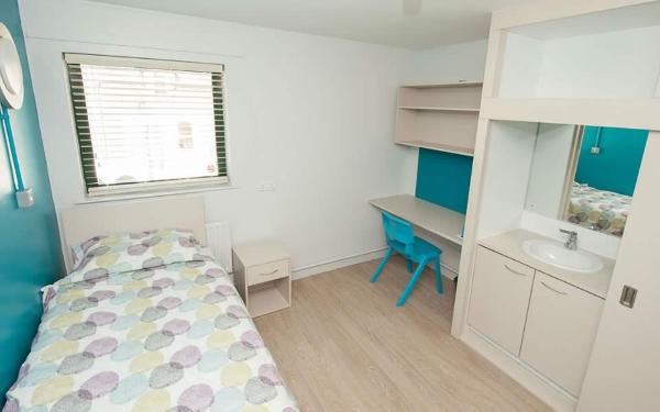 All study bedrooms are bright and spacious and have a washbasin, bed, desk, and wardrobe.