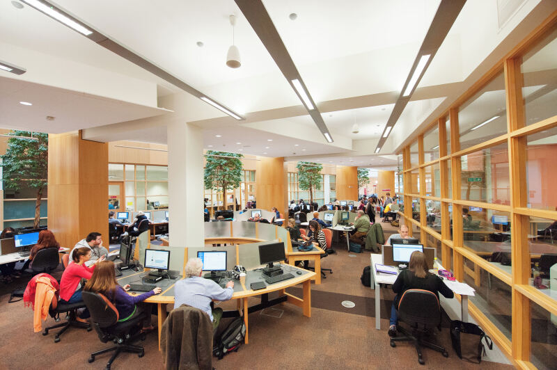Students at workstations in The McClay Library, Queen's University Belfast