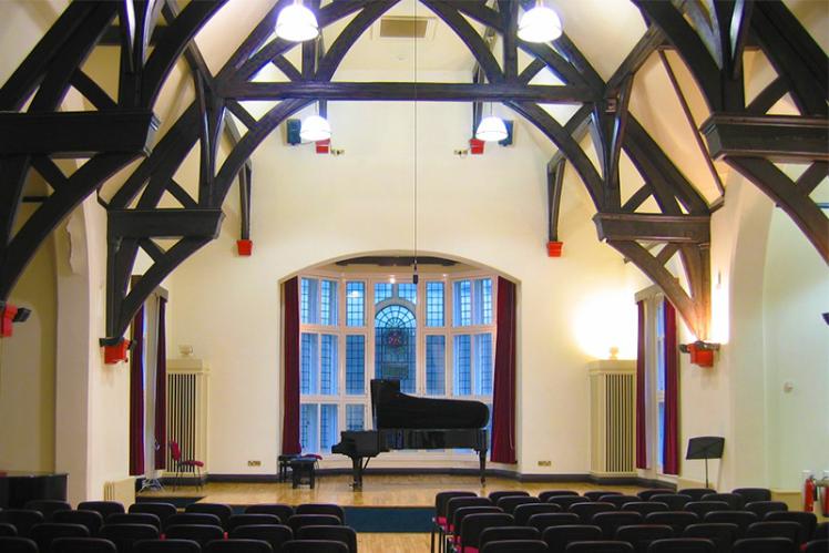 The Harty room with a piano on stage