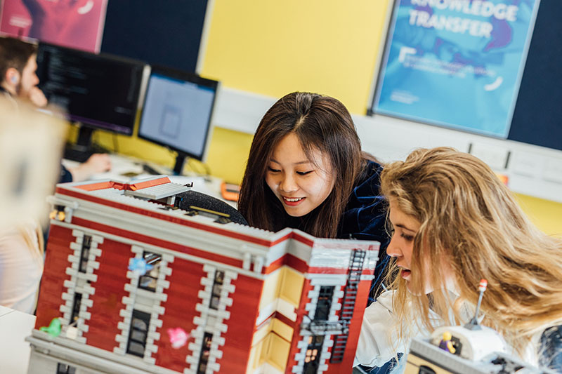 Students learning in the Lego Room in the Computer Science Building