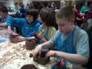 Belfast YAC members making coil-built replica America Indian pottery
