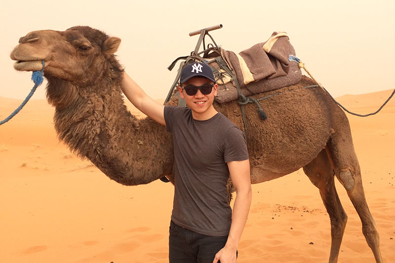 Rory Cao with a camel