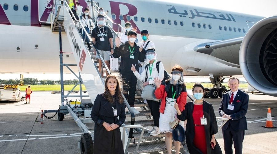 Students are greeted as they disembark