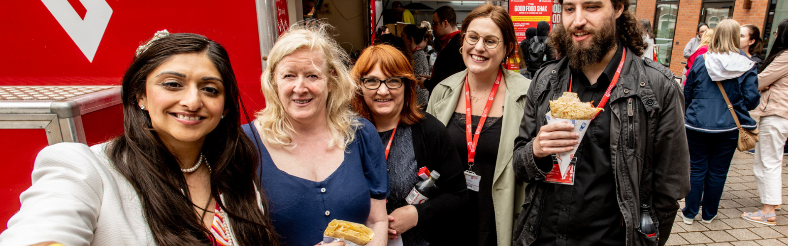 Image shows five staff members posing for a selfie at the Pride Picnic 2023.