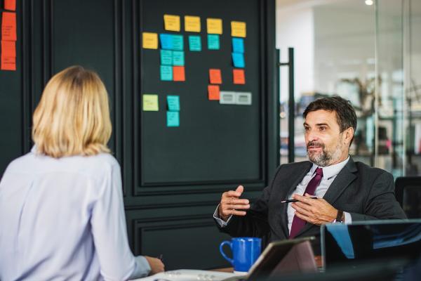 Man and Woman Having Office Meeting