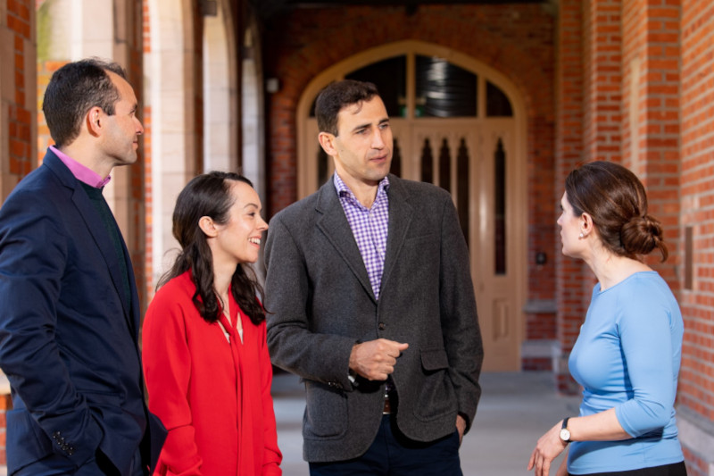 Colleagues Chatting outside the Lanyon Building at Queen's