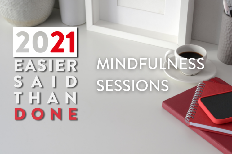 A red notebook and coffee cup sits on top of a table. Text reads: 2021: Easier Said Than Done. Mindfulness Sessions. 