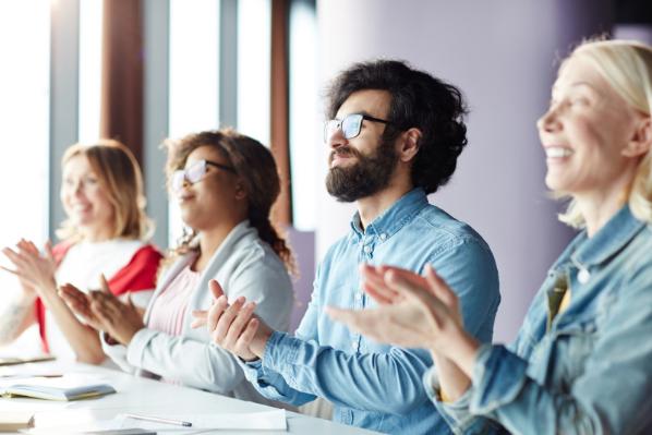 Man and Women Clapping Hands