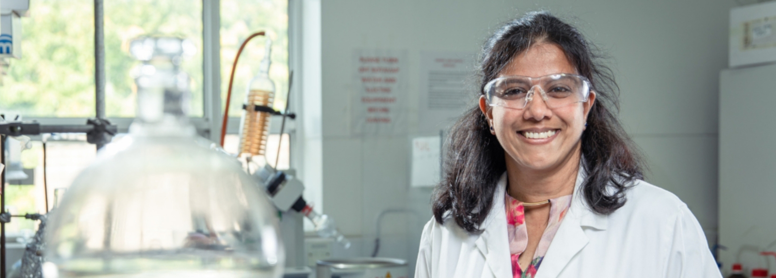 Smiling Woman at work in laboratory setting