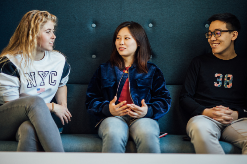 students sitting down chatting