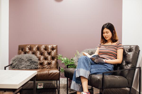 A student reading a book.