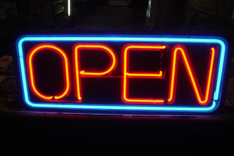 Image of an open sign with red and blue lighting