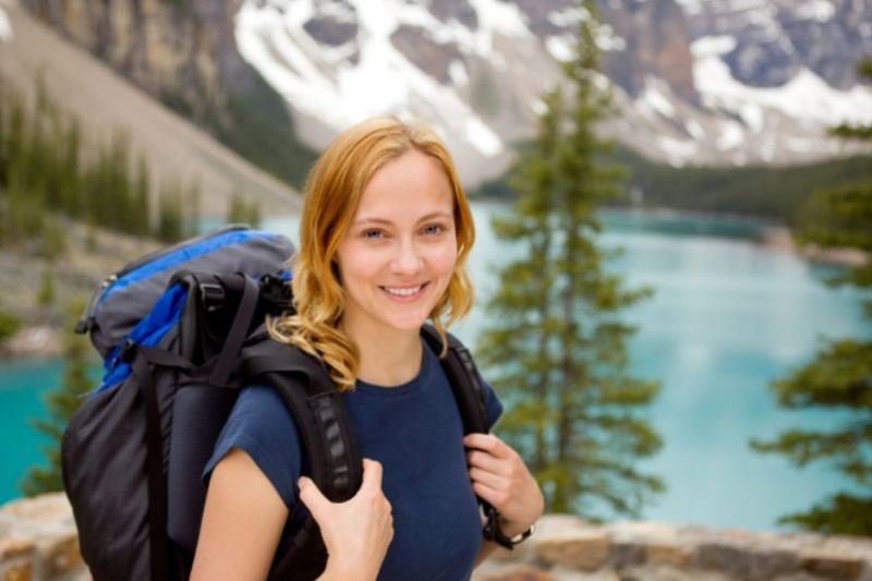 female with a backpack in a scenic location