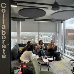 students in a working group sitting around a table