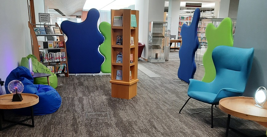 Comfy chairs, beanbags and books in the Wellbeing Space