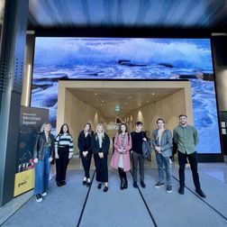 students standing in a group inside an employers premises on work shadowing week