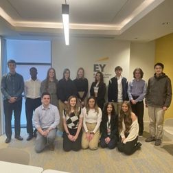 students standing in a group inside an employers premises on work shadowing week