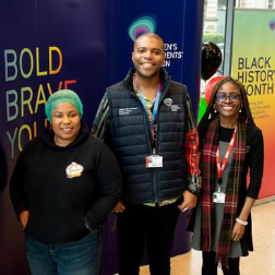 Image shows Students' Union Officer and University staff member, accompanied by a representative from Yetunde's Kitchen, posing for a photograph at the Black History Month event.