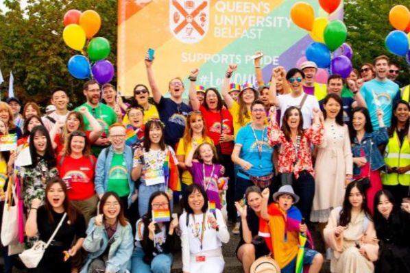 Image shows staff and students gathered at the 2019 Belfast Pride.