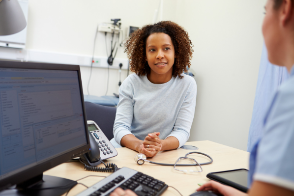 Image shows a woman having a consultation with Occupational Health