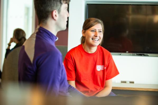 Image shows an in-situ shot of staff member at work in Queen's Accommodation