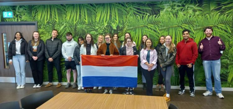 students on the Utrecht programme standing holding flag from Holland