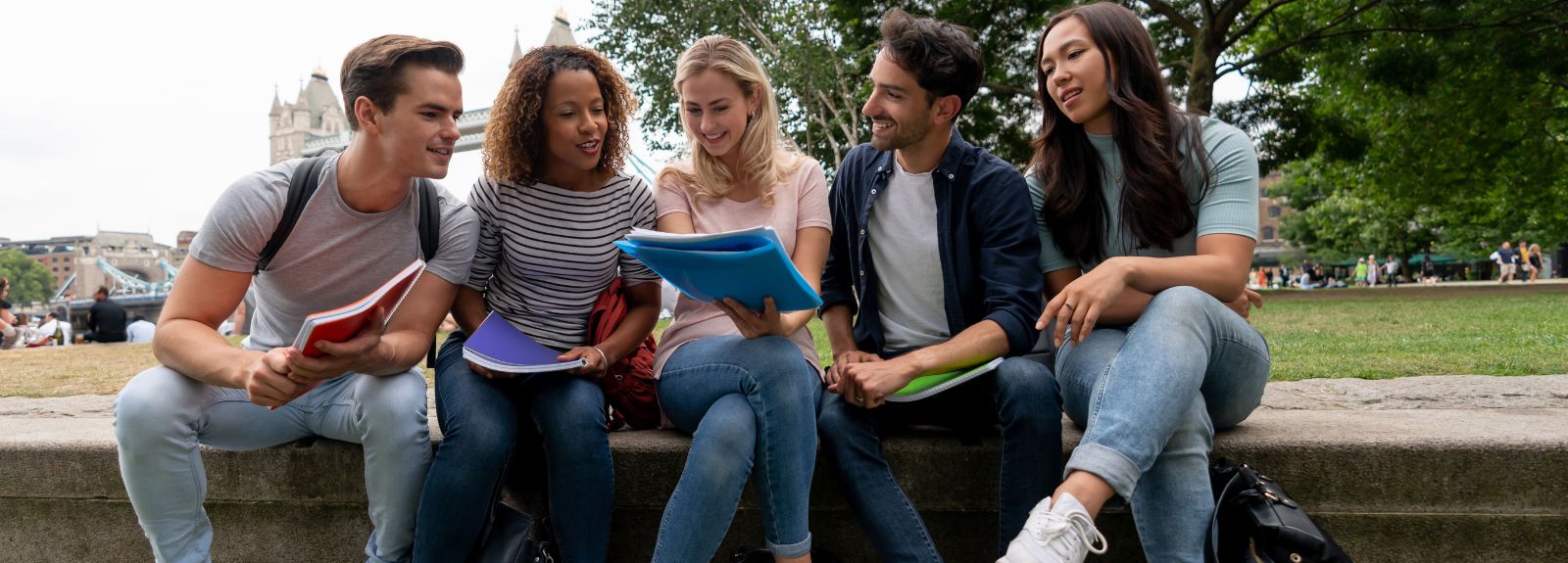 students sitting together on a bench outdoors