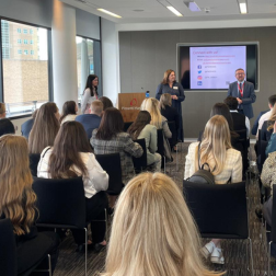 students istting in a room listening to a talk at an employers premises