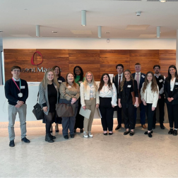 students standing together in the lobby of Pinsent Masons