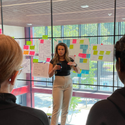 student giving a talk to a room full of other students