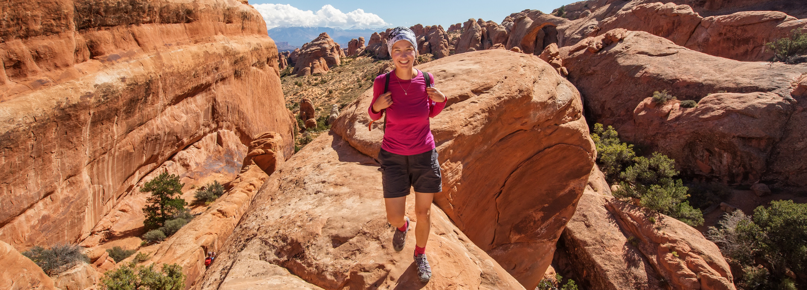 female standing in a scenic location