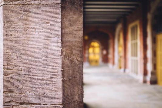 Close up of Lanyon Cloister and entrance to black and white hall in the background