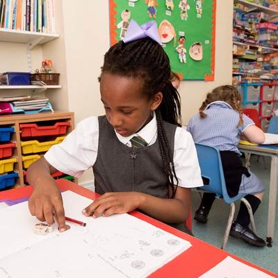 two girls doing their homework at the after school club