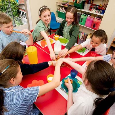 group of children enjoying snacks at the after school club