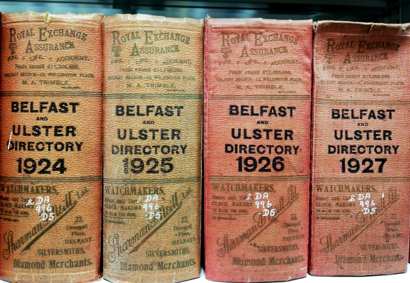 The spine of four Belfast Directories held by Special Collections.