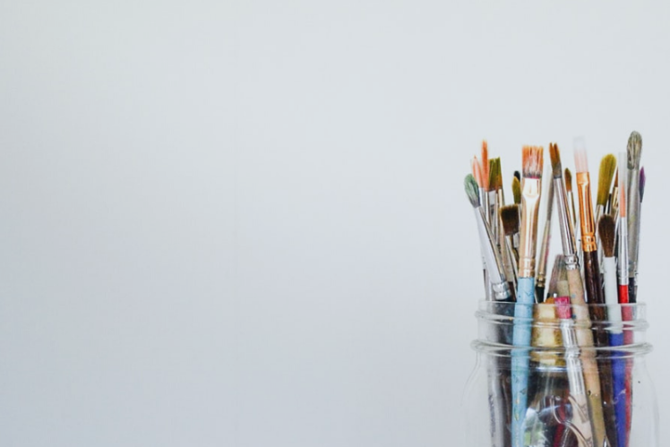 Paintbrushes in a jar