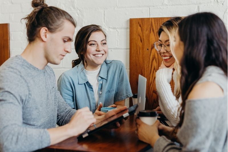 students talking at a table