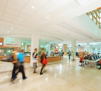 Students moving past McClay Library Reception