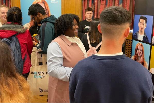 students at an employer event chatting to employers at stands