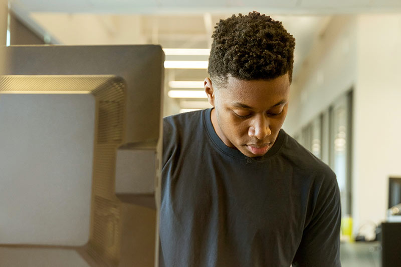 Black student at a computer