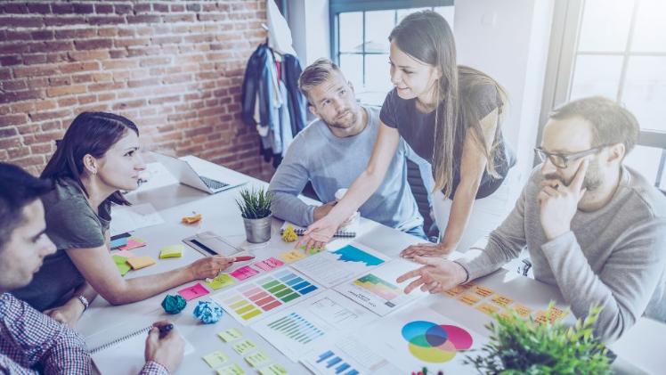 people in a work setting brainstorming ideas