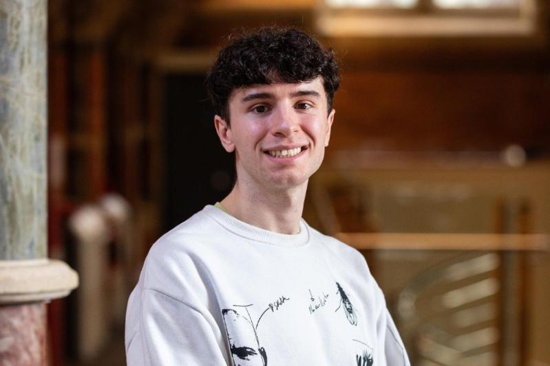 Young man smiling to the camera at a recent IES catch-up event