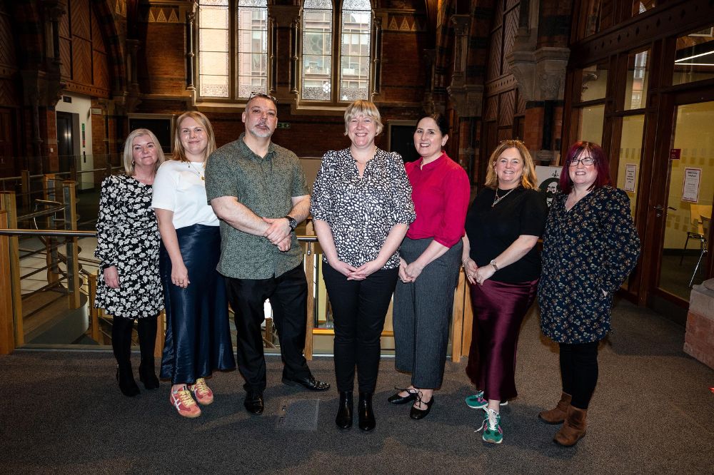 Group image of people standing smiling at the Inclusive Employment Scheme Catch-up Event