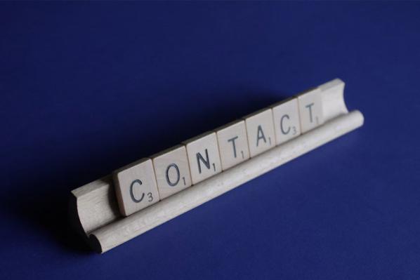 Scrabble tiles spelling out the word 'Contact'
