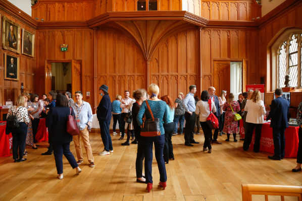 Image shows staff gathered in the Great Hall for a career development event.