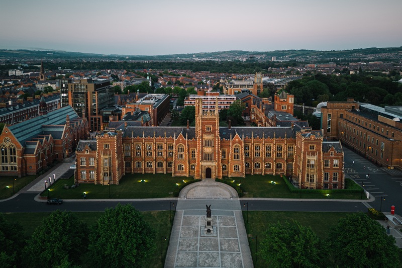 Aerial view of the Lanyon Building at Queen’s University Belfast during twilight.