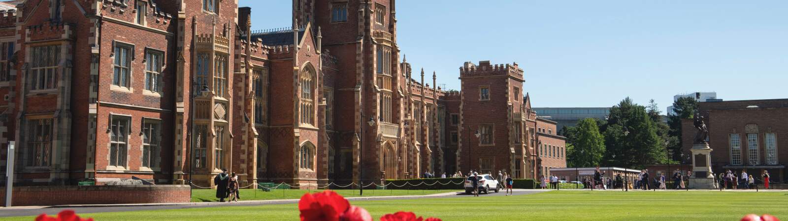 The Lanyon building on a nice summer day with flowers in bloom.