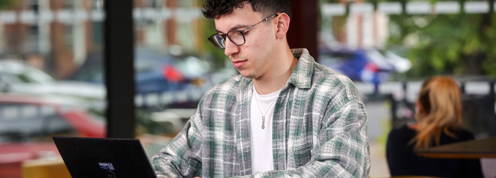 male student on laptop
