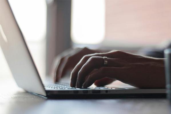A user working at a laptop