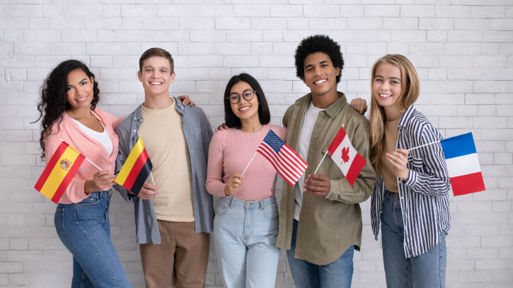 students of different nationalities holding flags